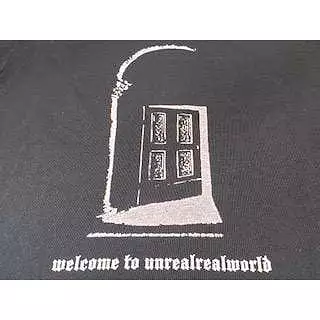 UNDERCOVER Welcome to Unreal Real World Tee